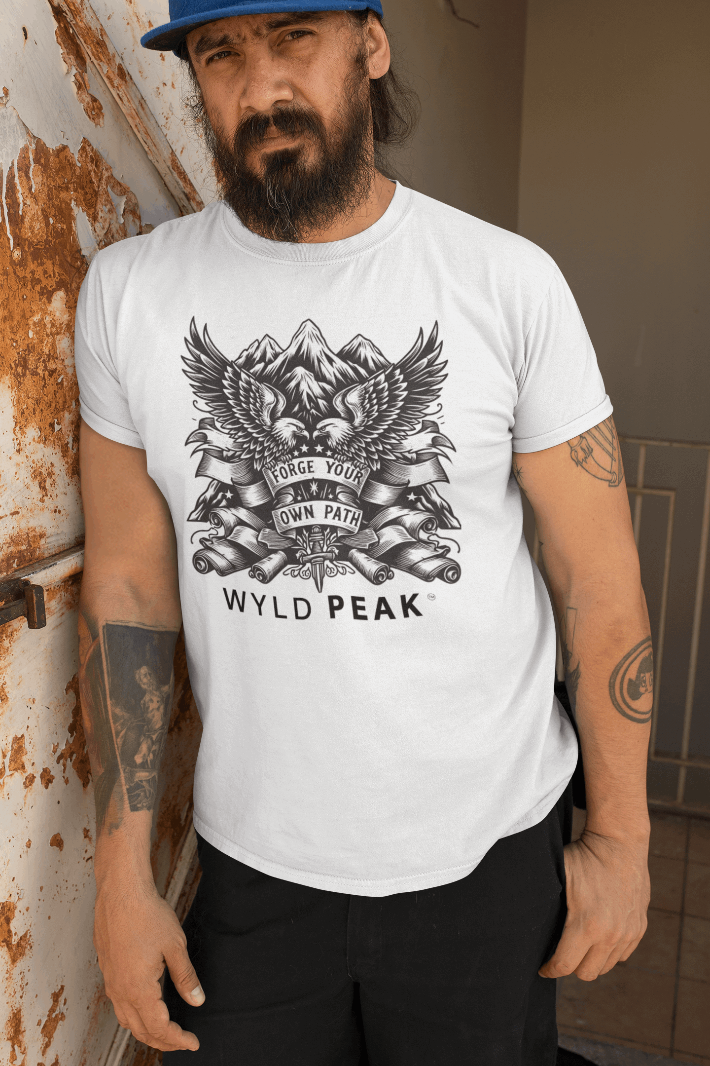 Bearded man wearing Wyld Peak American Design tee in white during lifestyle shoot.
