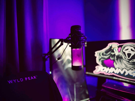 Johnny Ghost’s gaming and streaming station with dual monitors, LED lighting, and paranormal gear on display