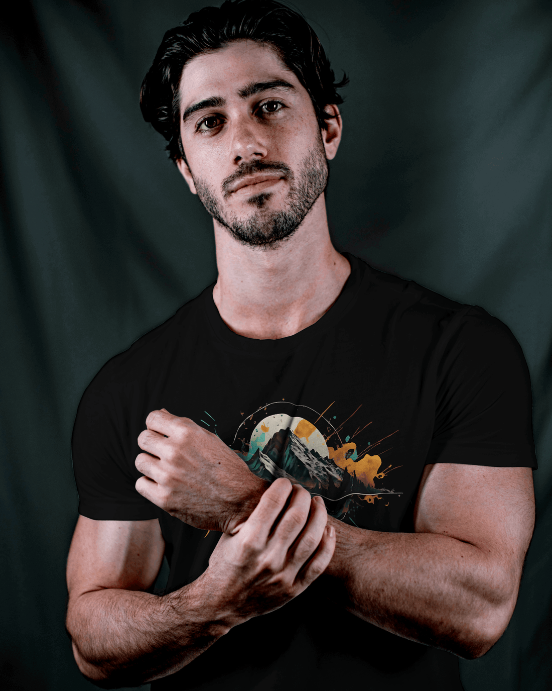 Stylish man wearing the Wyld Peak Peak Design organic cotton tee, perfect for everyday adventure wear