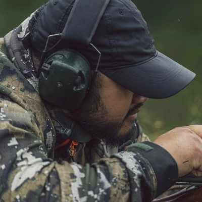 Abishai from Wyld Peak wearing signature cap at Surplus Steel shooting competition in Taranaki.