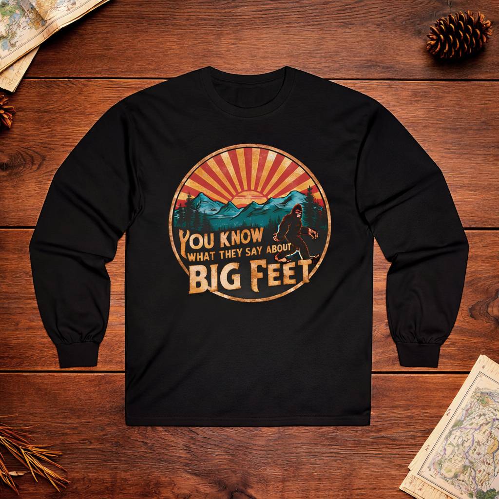 Black long-sleeve shirt with a graphic design on a wooden surface