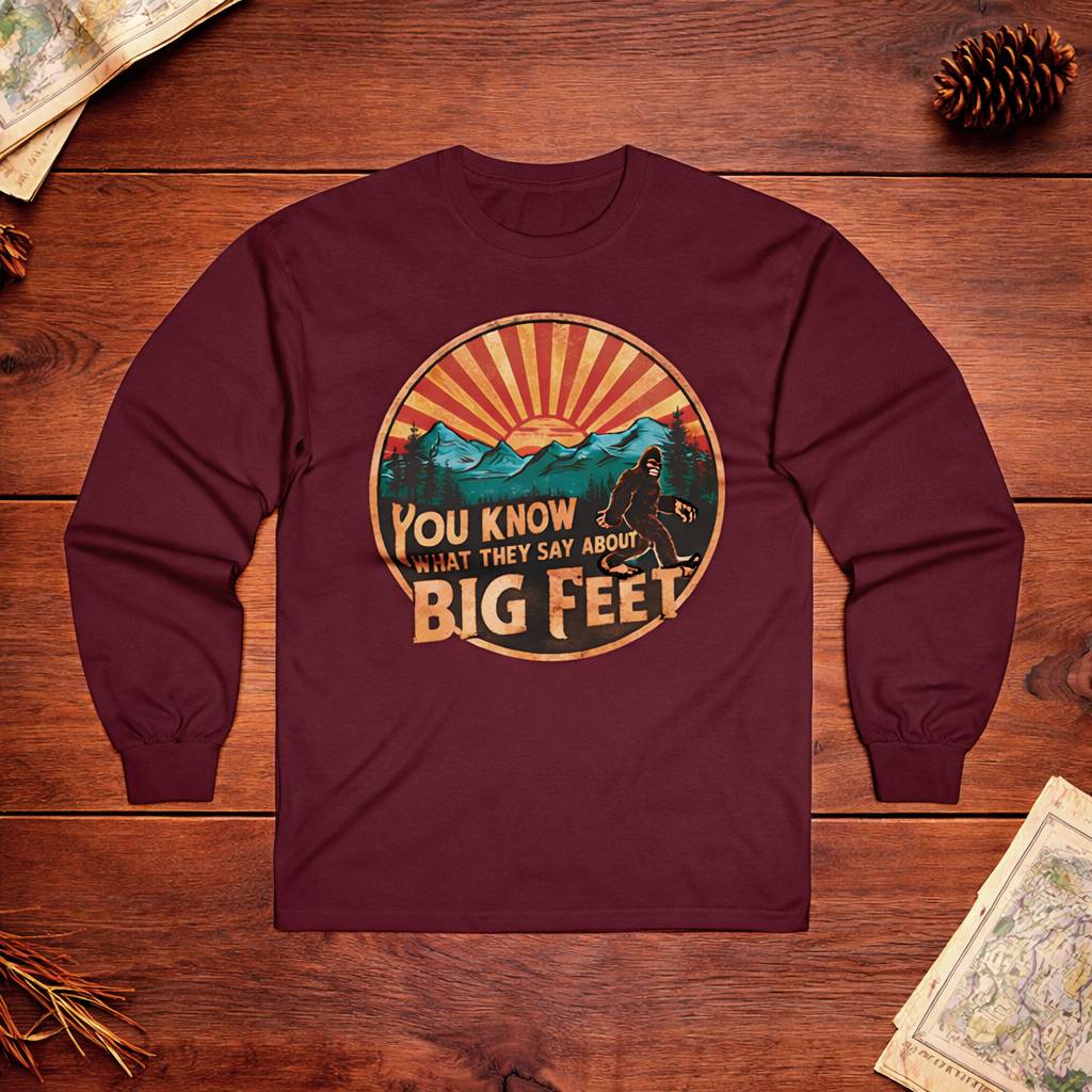 Maroon long-sleeve shirt with graphic design on a wooden surface