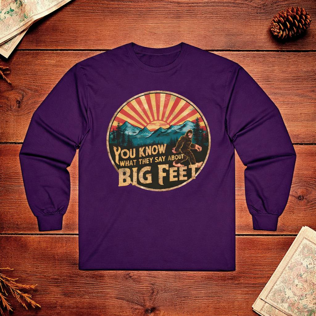 Purple long-sleeve shirt with graphic design on a wooden surface