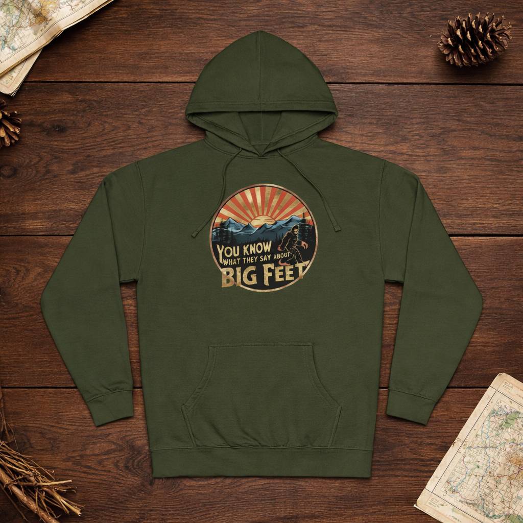 Green hoodie with a graphic design on a wooden surface
