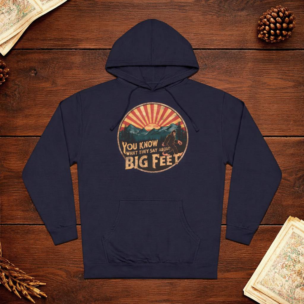 Navy blue hoodie with graphic design on a wooden surface
