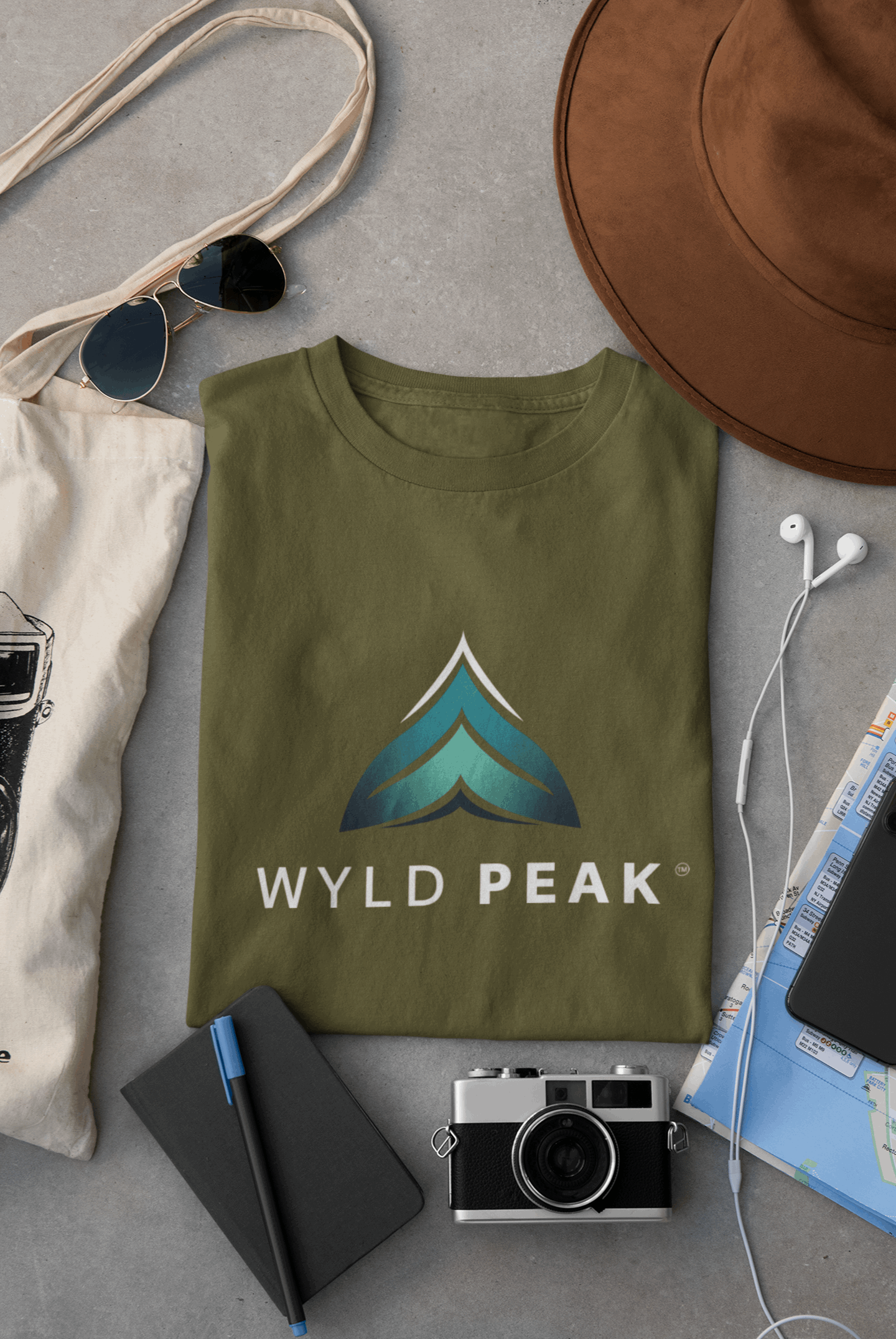 Branded women's organic cotton T-shirt in army green lay flat on desk.