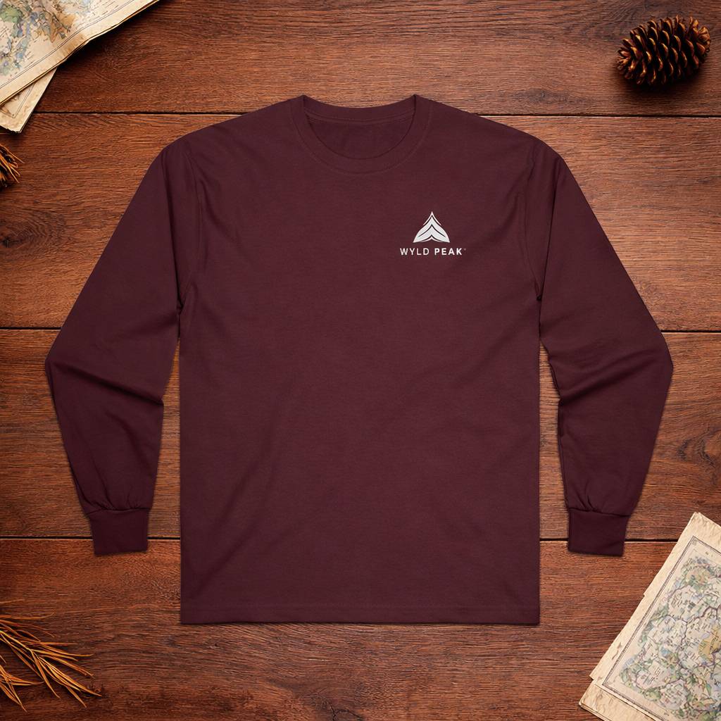 Maroon long-sleeve shirt with a logo on a wooden surface