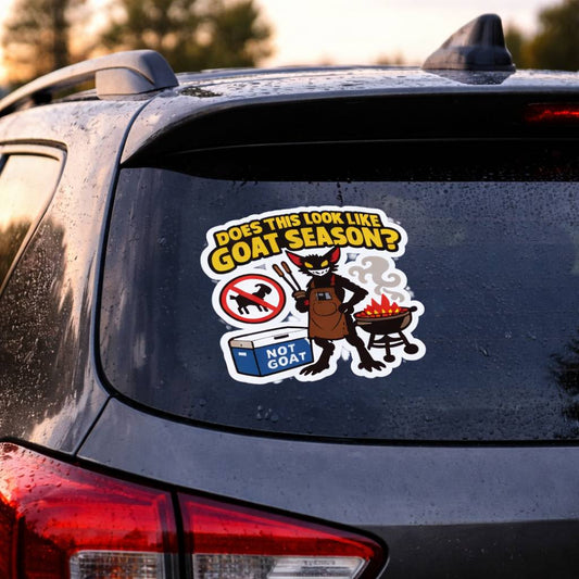 Car with a humorous 'Does this look like goat season?' sticker on the back window.