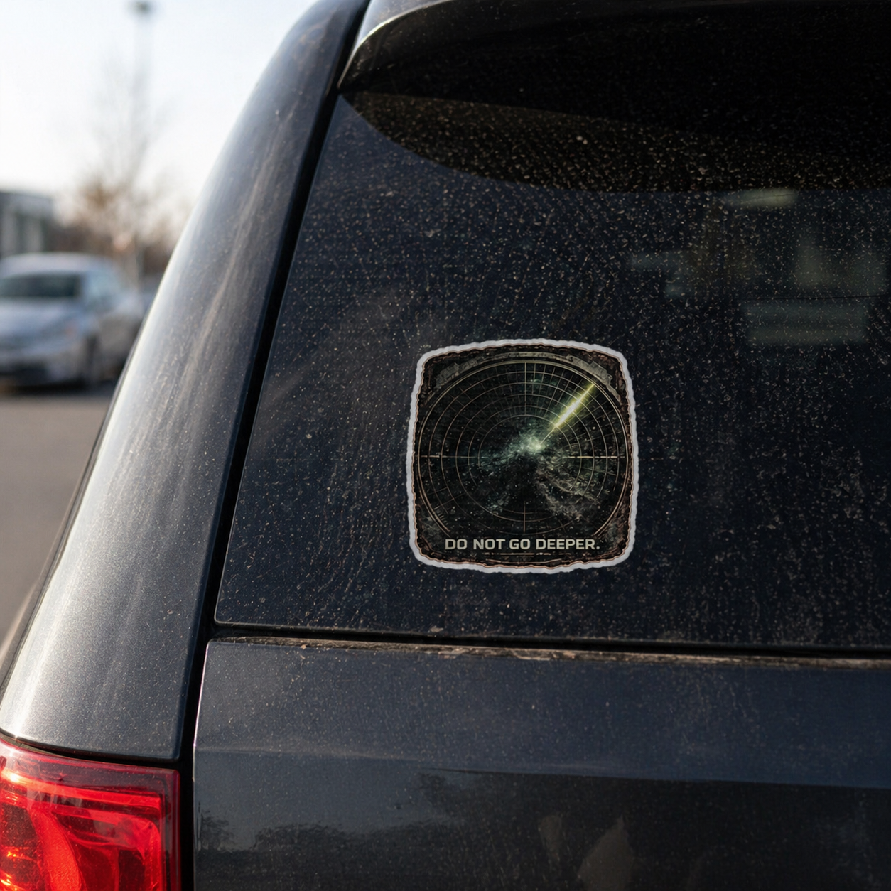Car sticker with 'Do Not Go Deeper' text on a vehicle's rear window.