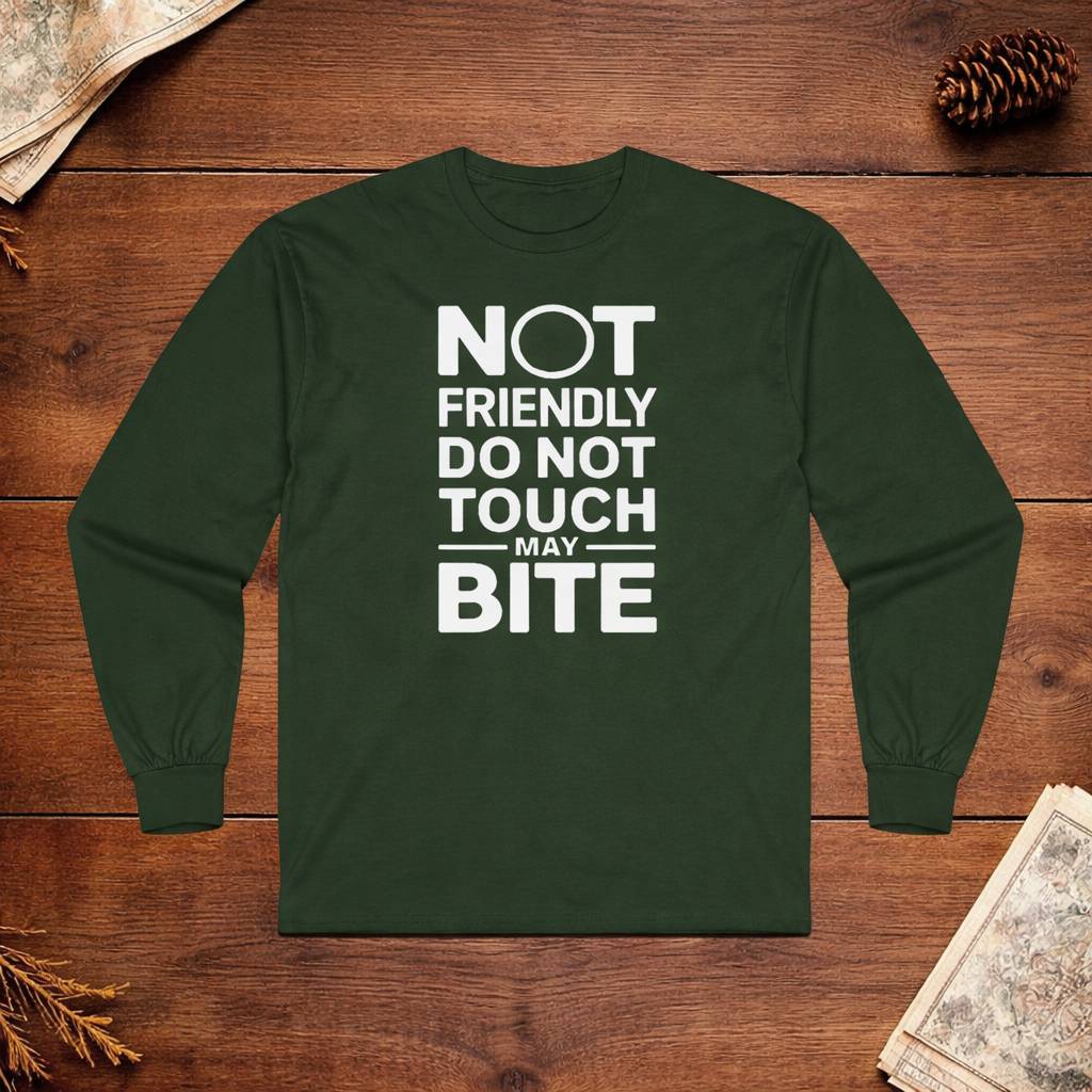 Green long-sleeve shirt with text on a wooden surface