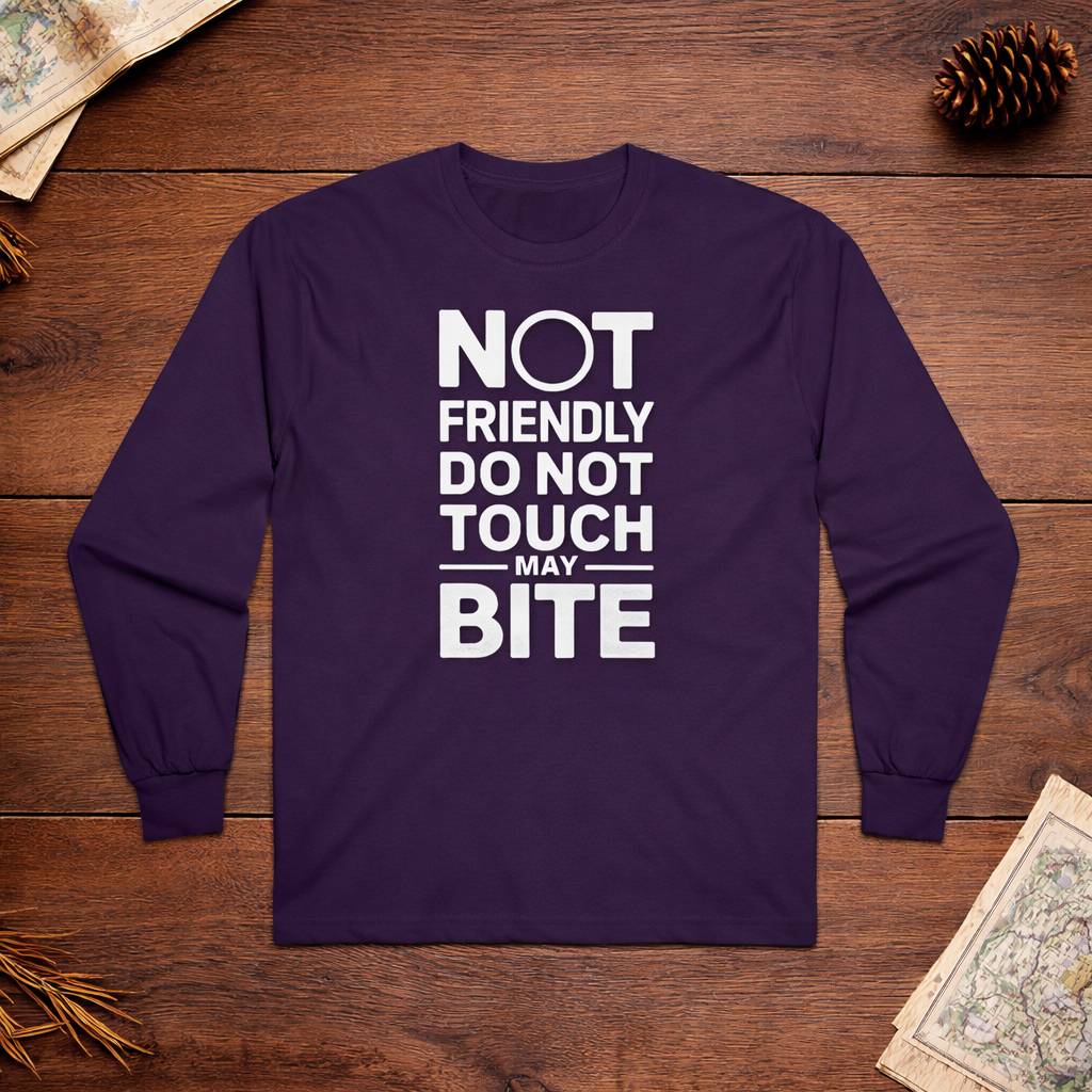 Purple long-sleeve shirt with white text on a wooden surface