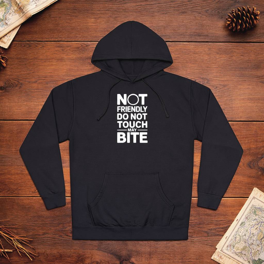 Black hoodie with text on a wooden surface