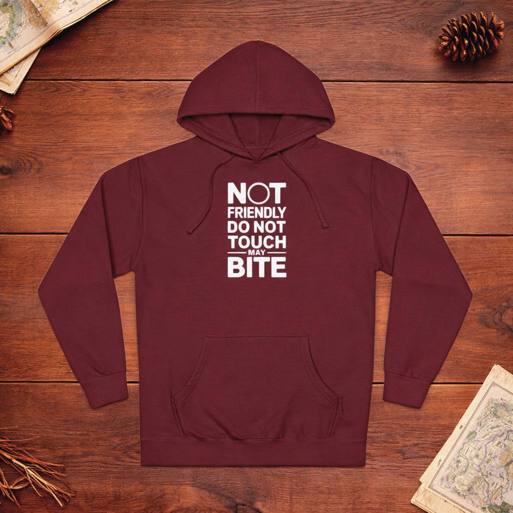 Maroon hoodie with text on a wooden surface