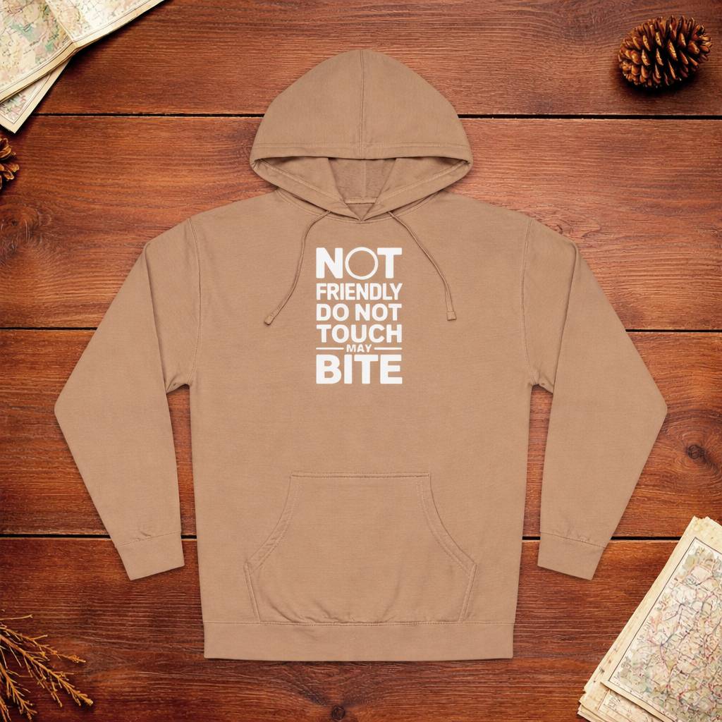 Brown hoodie with text on a wooden surface