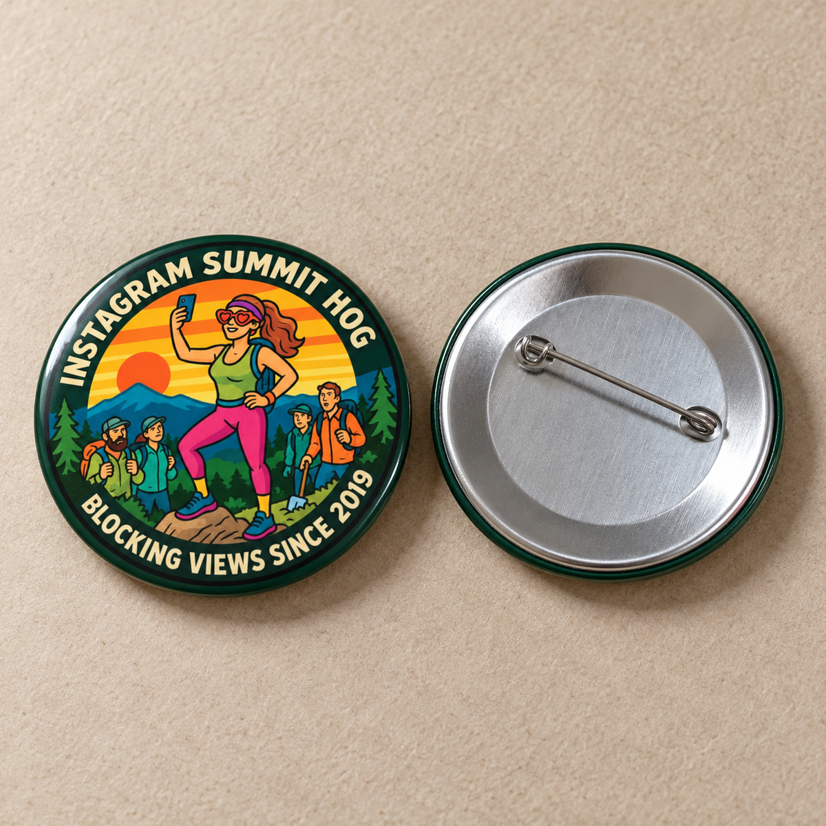 Two round pinback buttons on a beige textured background. The left button shows a colorful illustrated scene with hikers and the text 'Summit HOG Blocking Views Since 2019.