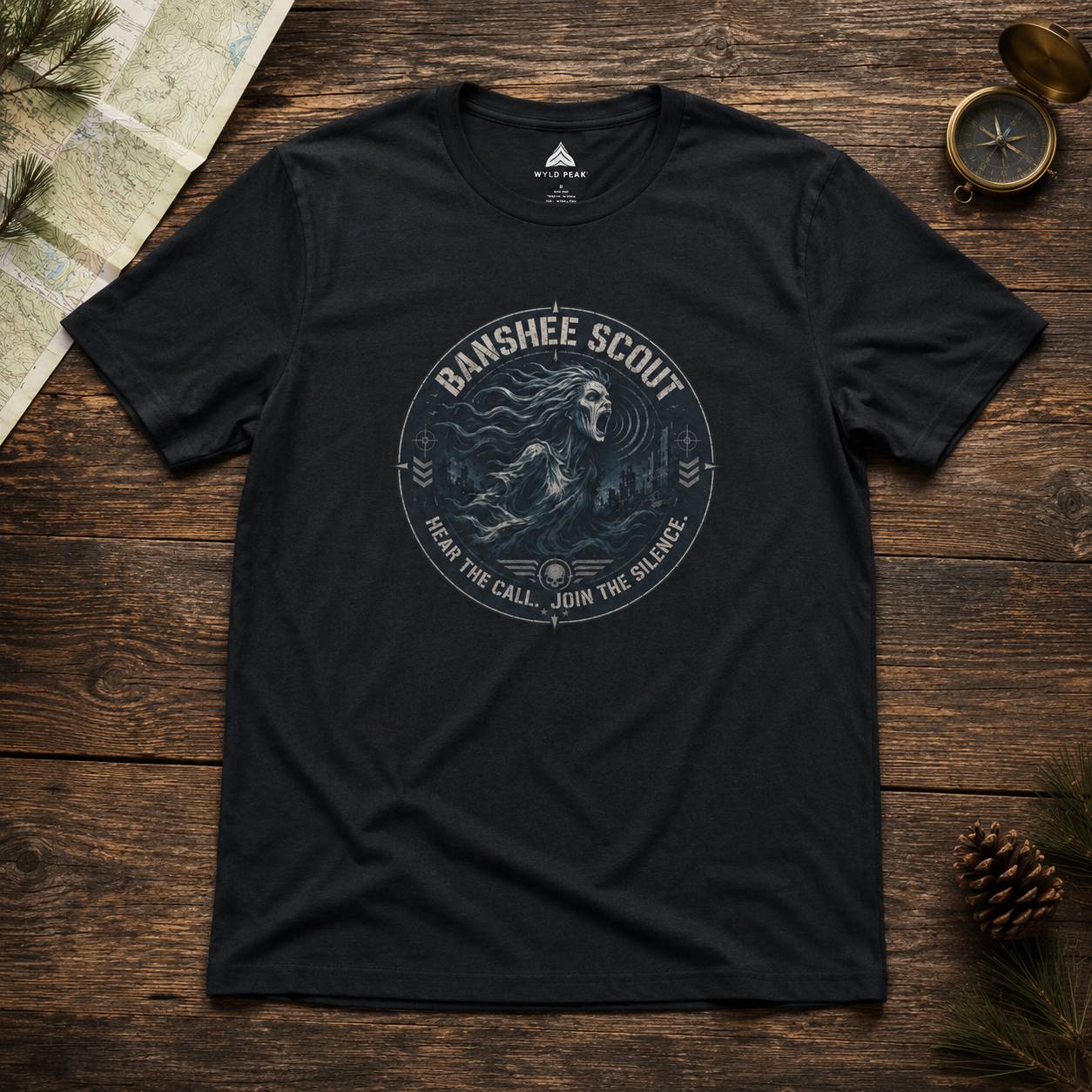 Black t-shirt with 'Banshee Scout' graphic on a wooden surface