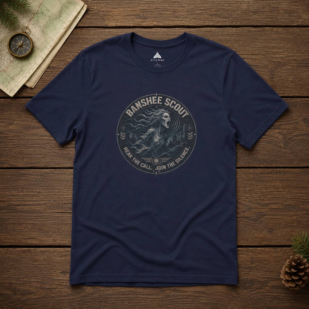 Navy blue t-shirt with 'Banshee Scout' graphic on a wooden surface