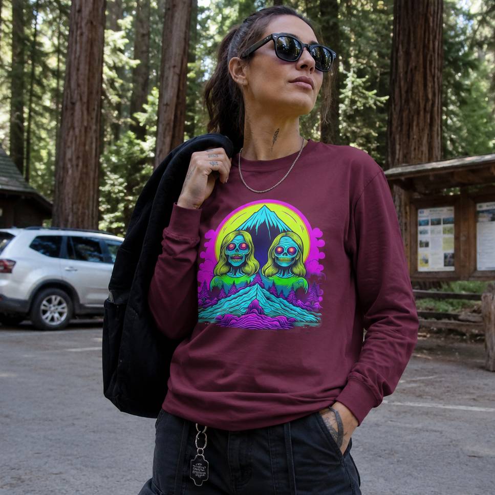 Person wearing a maroon sweatshirt with a colorful graphic in a forest setting
