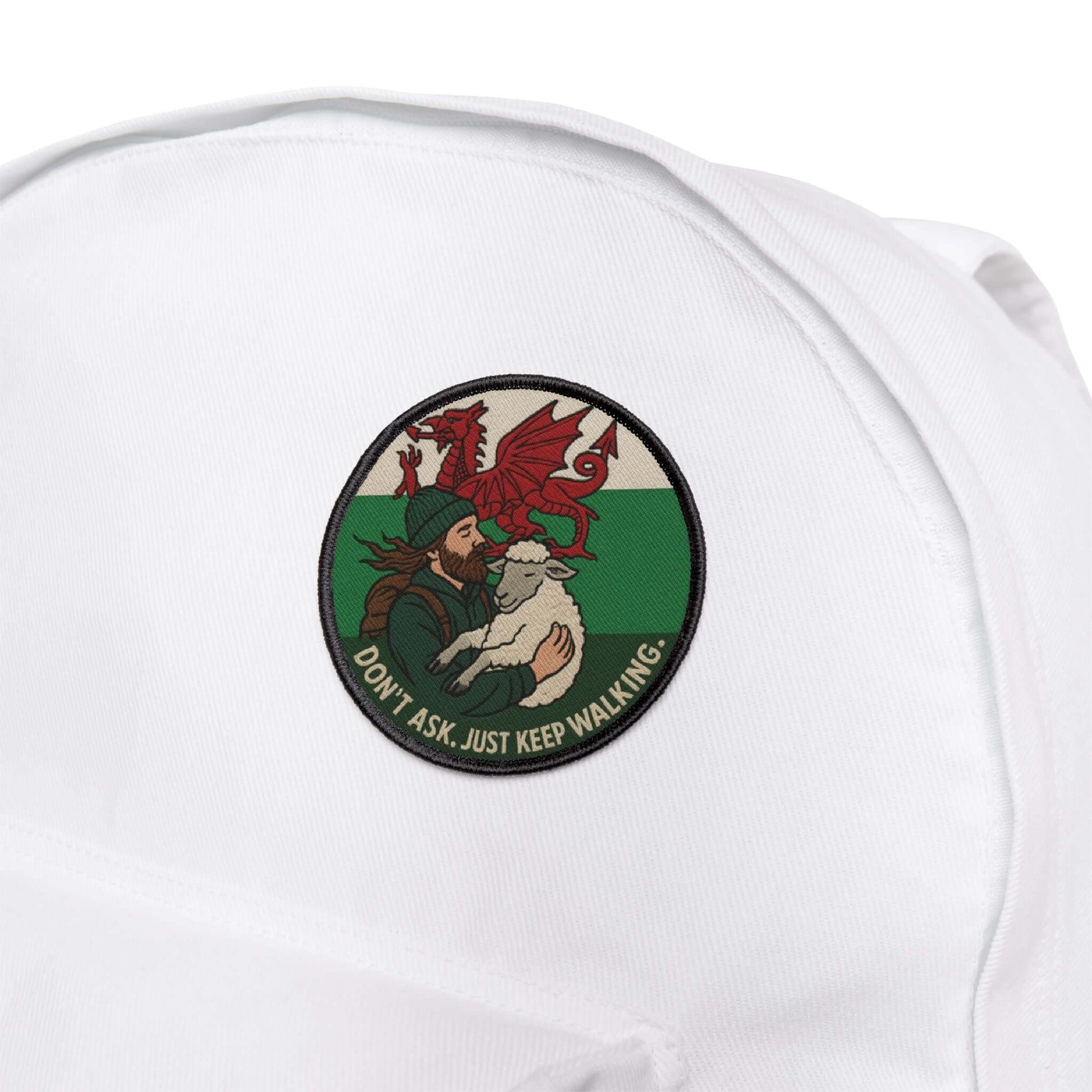 Wyld Peak Lost in Wales patch featuring a sheep, on a white backpack