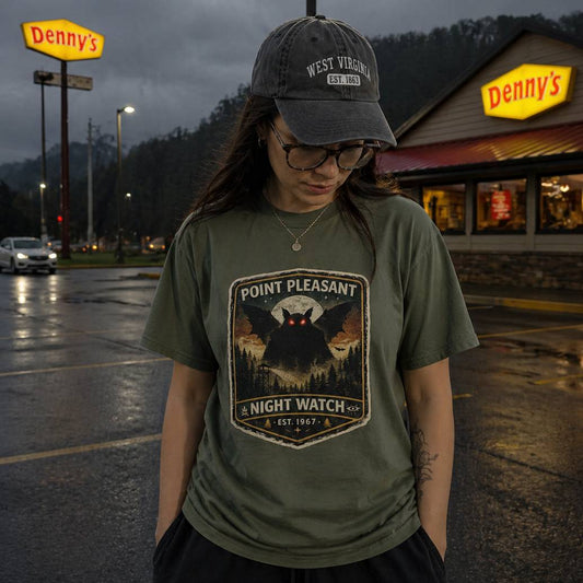 Person wearing a 'Point Pleasant Night Watch' t-shirt in front of a Denny's restaurant.