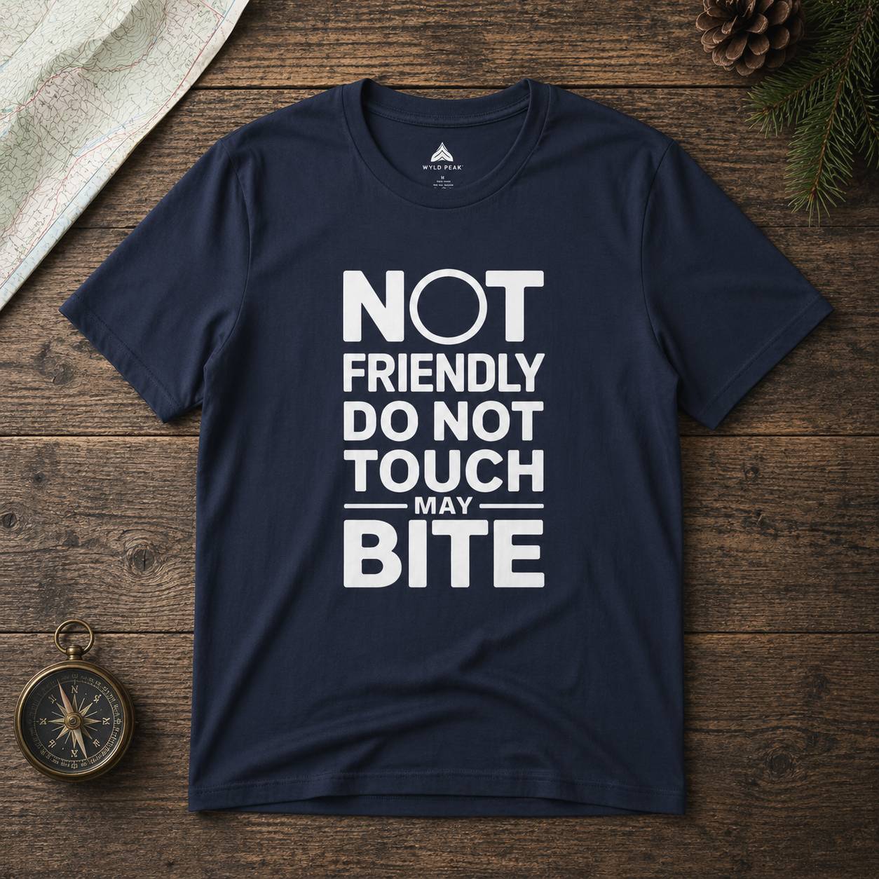 Navy blue t-shirt with white text on a wooden surface