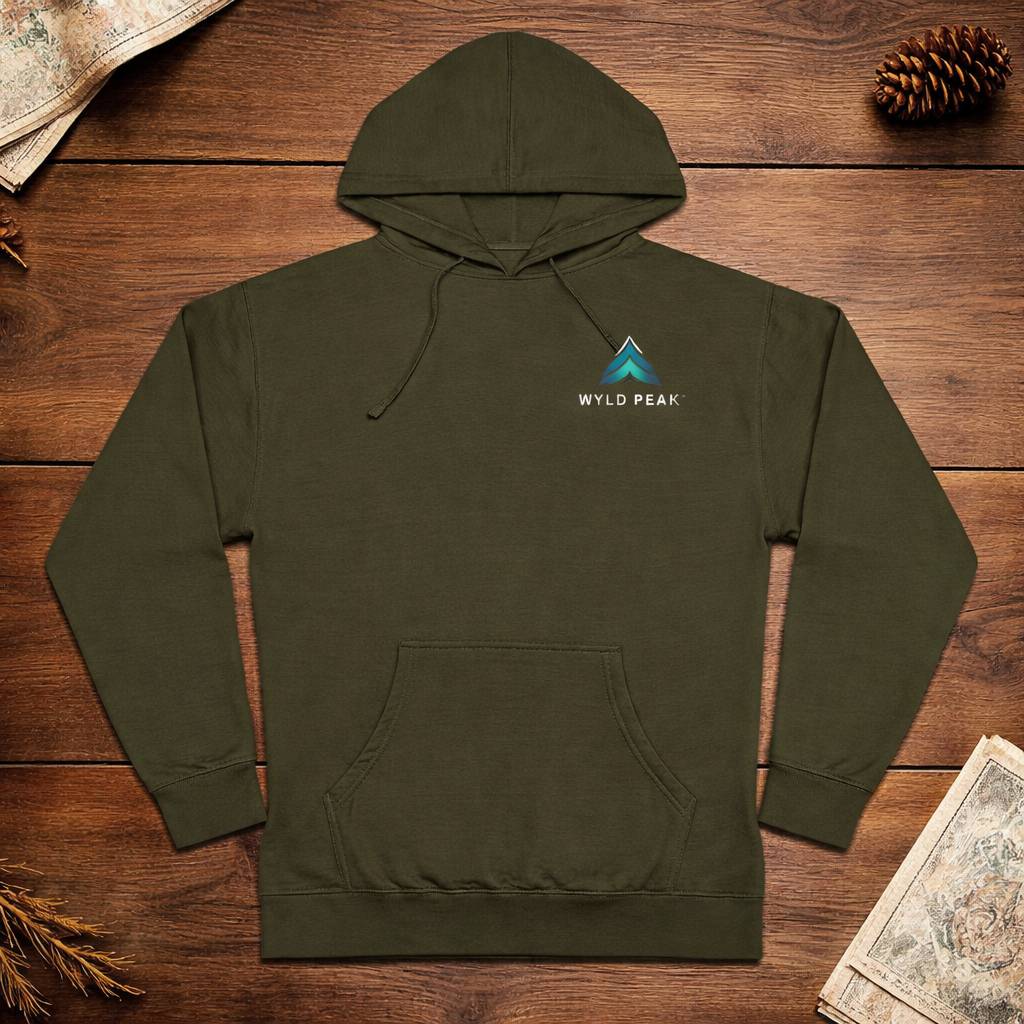 Green hoodie with Wyld Peak logo on a wooden surface