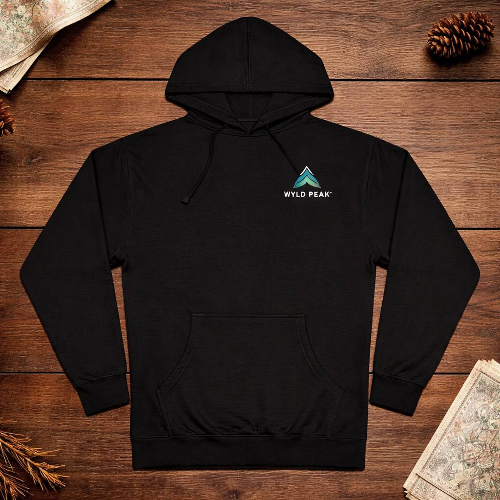 Black hoodie with 'Wyld Peak' logo on a wooden surface