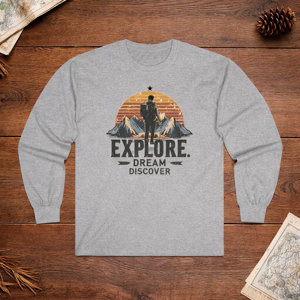 Gray long-sleeve shirt with mountain and text design on a wooden surface