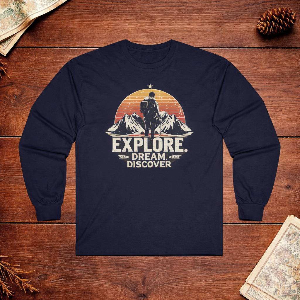 Navy blue long-sleeve shirt with 'Explore. Dream Discover' graphic on a wooden surface.