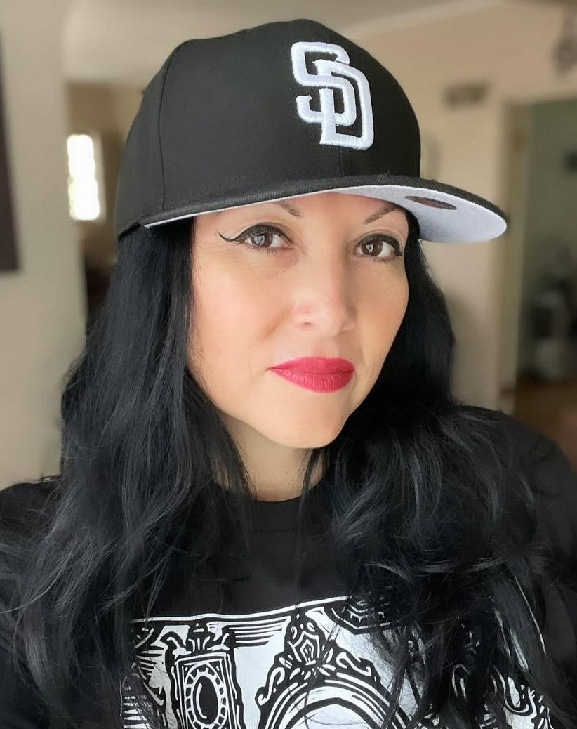 Sonny Black taking a selfie in a Wyld Peak hoodie and cap