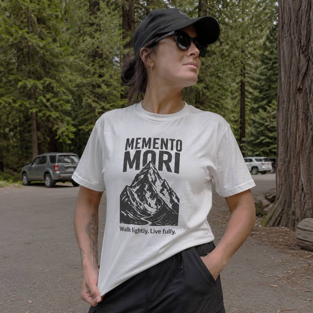 Person wearing a 'Memento Mori' t-shirt in a forest setting
