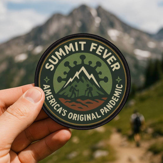 Summit Fever hiking patch held on trail background - funny morale badge for hikers