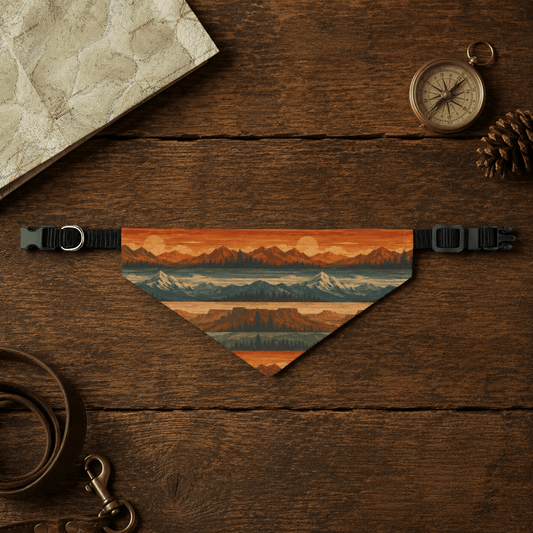 Dog collar with scenic design on a wooden surface with map, compass, and pine cone.