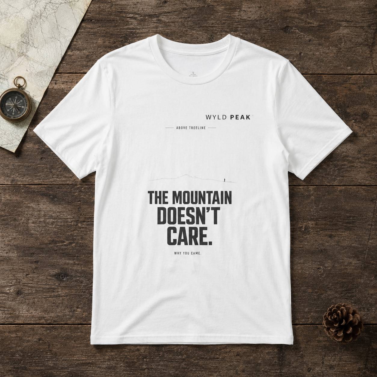 White t-shirt with text on a wooden surface
