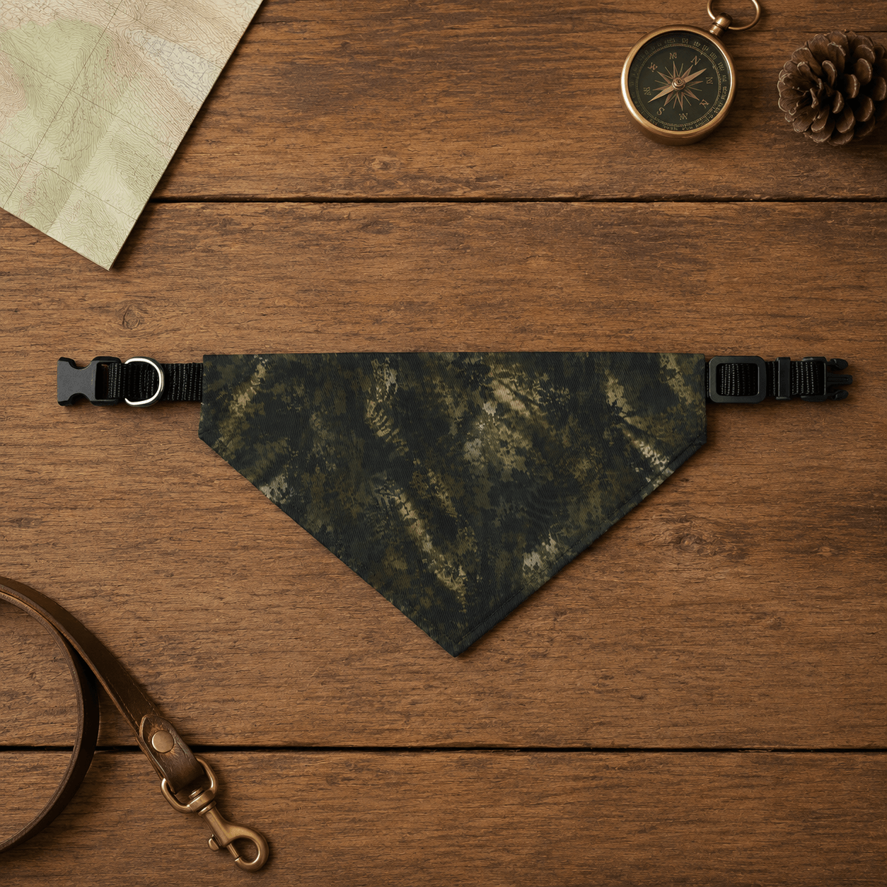 Camouflage bandana on a wooden surface with accessories.
