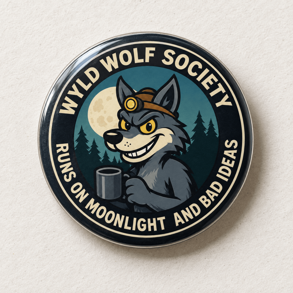 A circular enamel pin featuring a cartoon gray wolf wearing a brown headlamp and holding a mug, with a full moon and pine trees in the background. The pin has a black outer border with the text 'WYLD WOLF SOCIETY' and 'RUNS ON MOONLIGHT AND BAD IDEAS' in cream lettering.