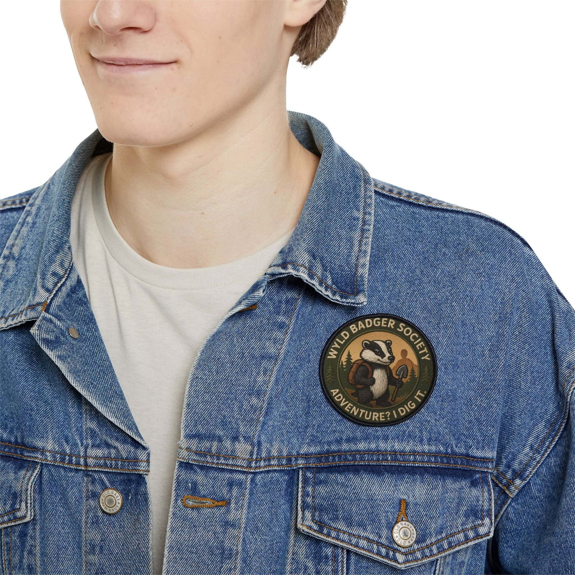 Wyld Badger Society patch worn on a man’s denim jacket, rugged outdoor patch with strong character
