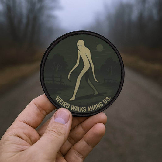 Wyld Peak Fresno Nightcrawler patch being held in the Fresno backcountry at dusk