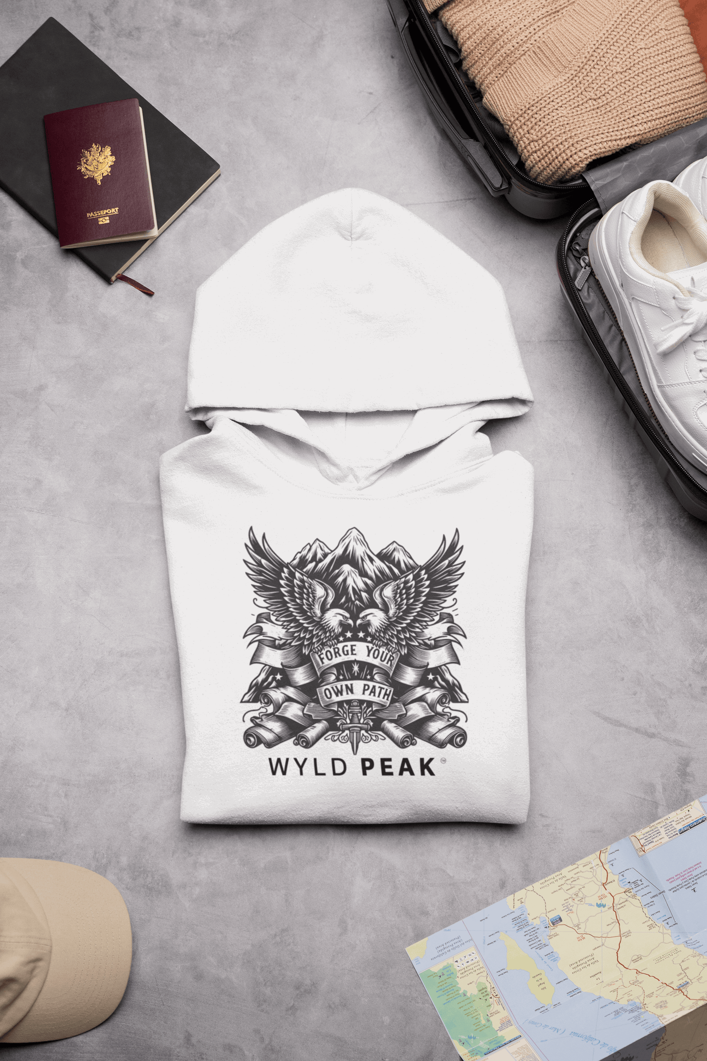 Wyld Peak Americana unisex cotton hoodie in white lay flat on desk.