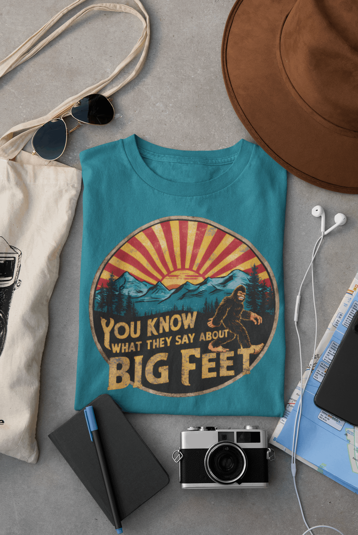 Blue Wyld Peak Bigfoot women's organic tee laid flat for product listing