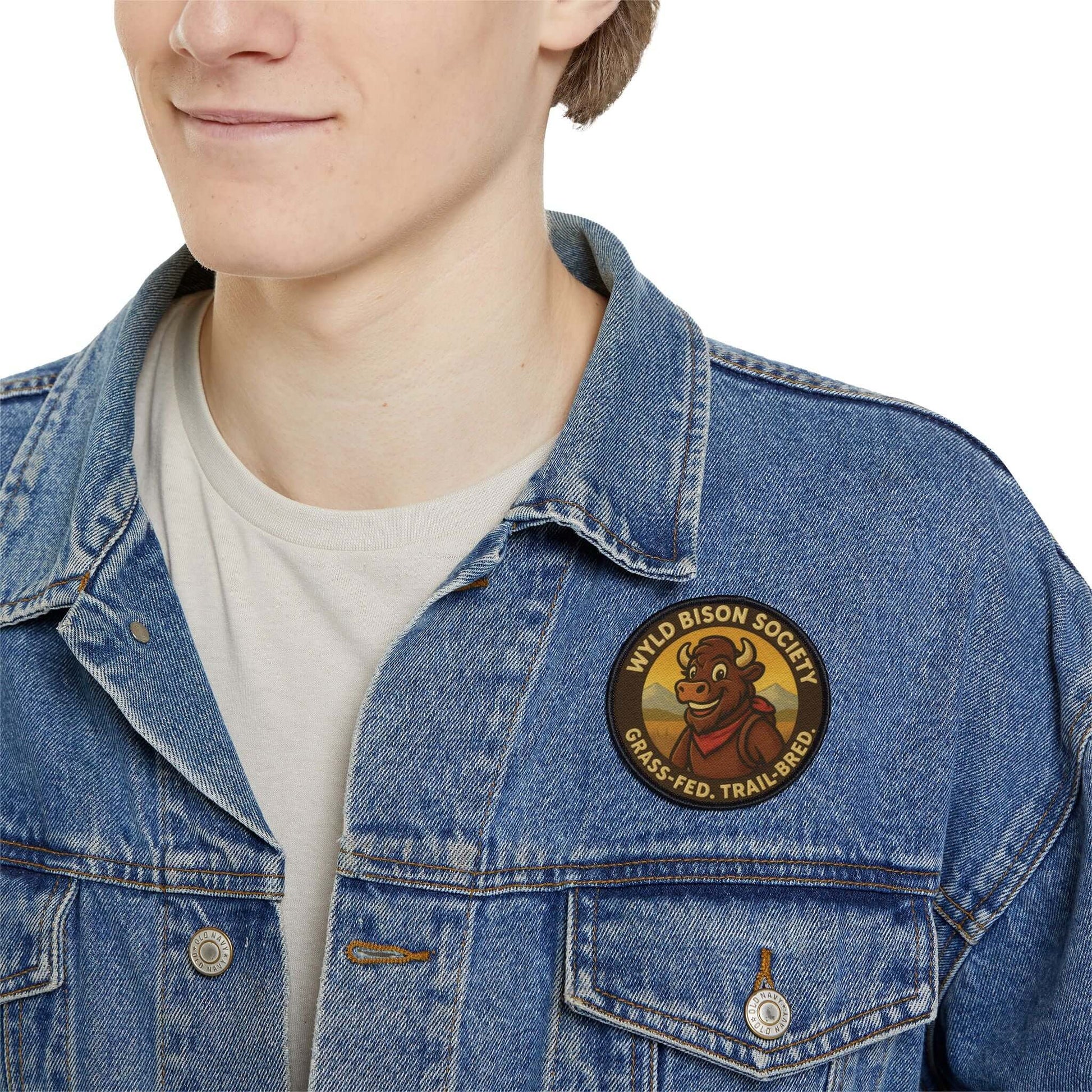 Bison Society patch worn on a man’s denim jacket, bold outdoor patch with classic American character