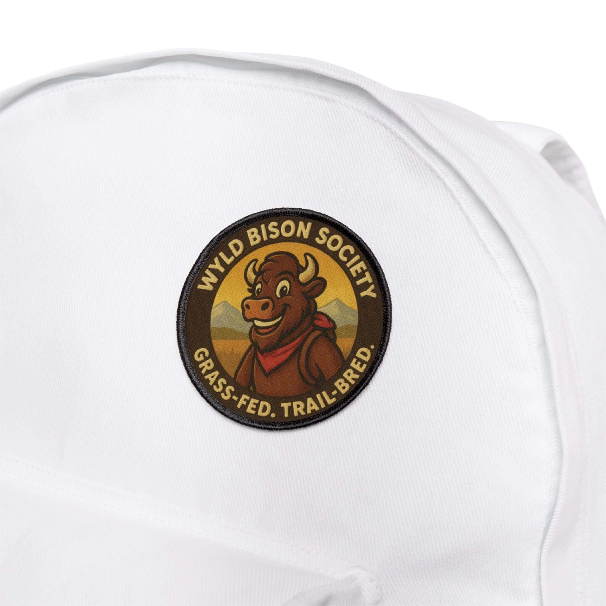 Bison Society patch attached to a white backpack, durable patch built for trails and travel