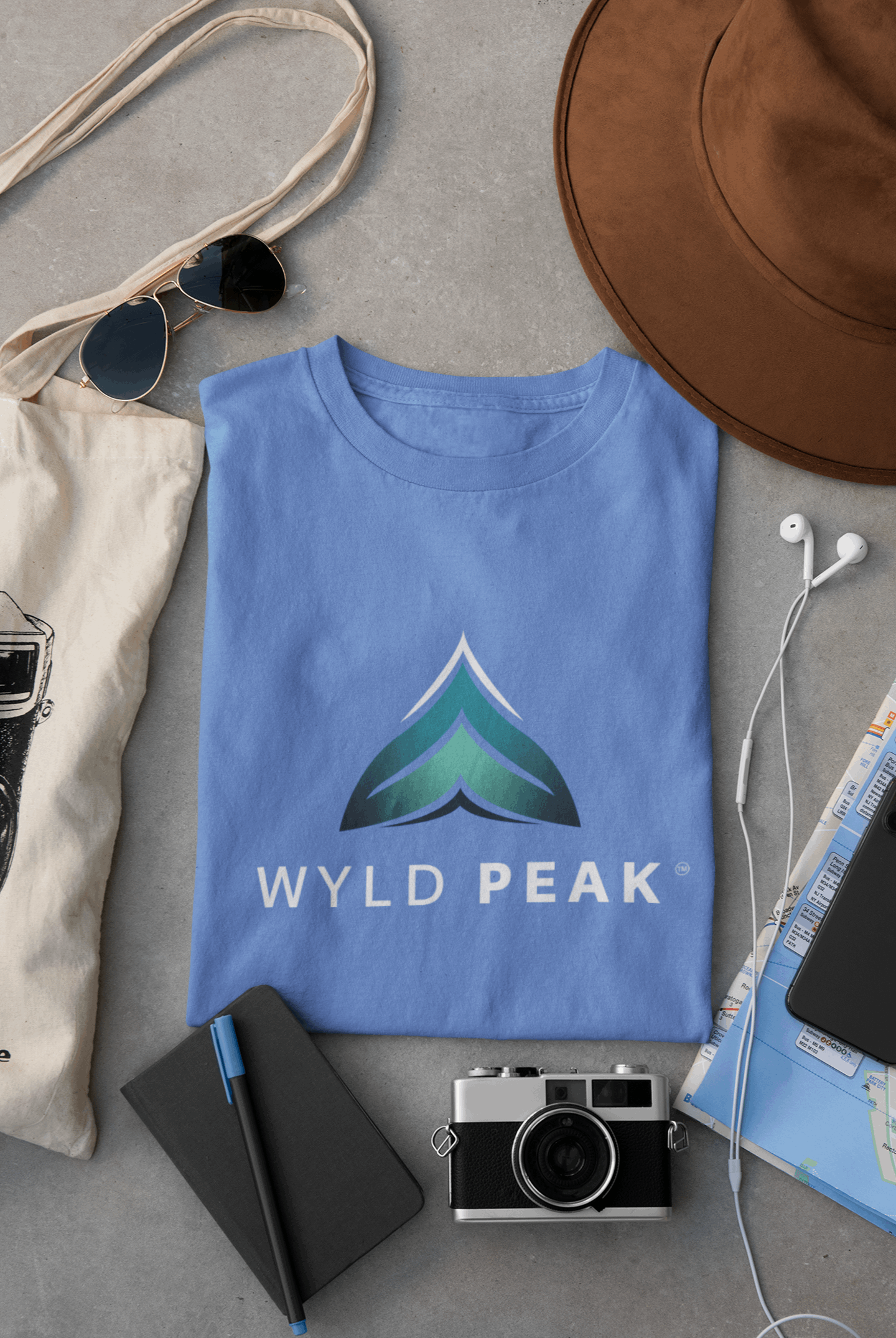 Heather blue Wyld Peak branded men's organic cotton t-shirt flat lay product display