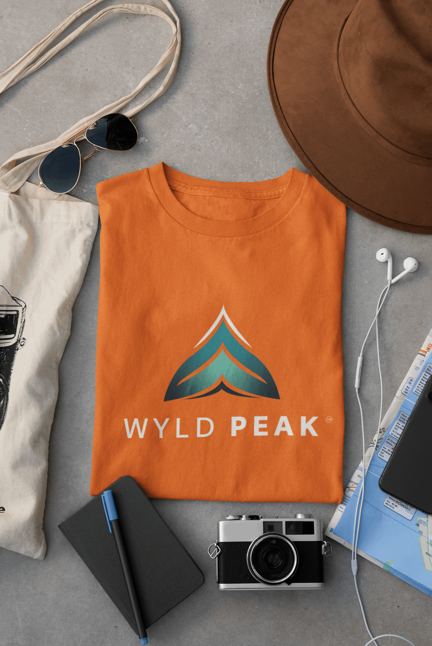 Orange Wyld Peak branded men's organic cotton t-shirt flat lay product image