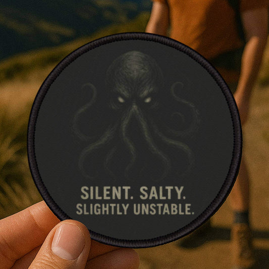 Cthulhu patch photographed outdoors on a rugged hiking trail