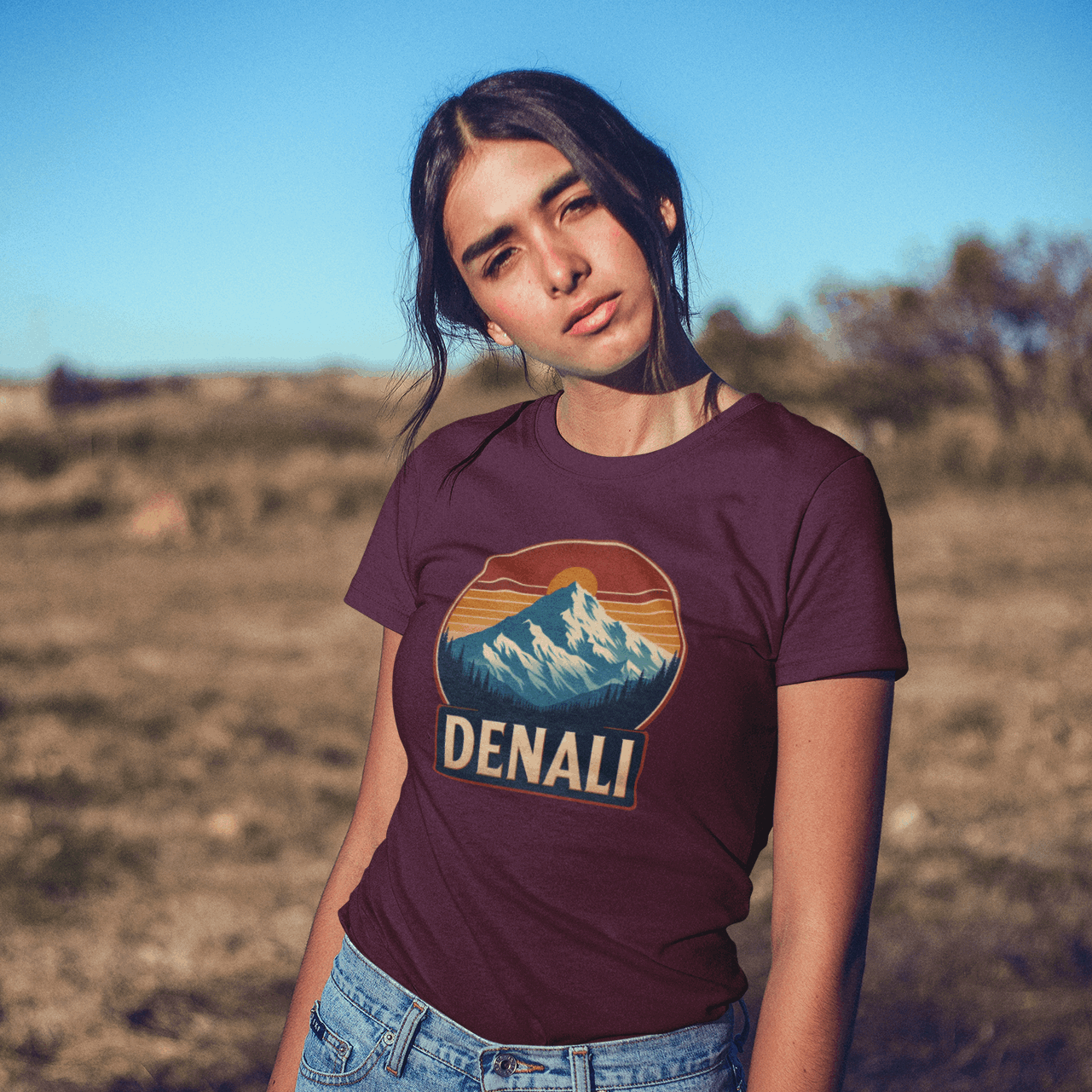 Woman in California wearing Wyld Peak Denali National Park organic cotton tee in maroon.