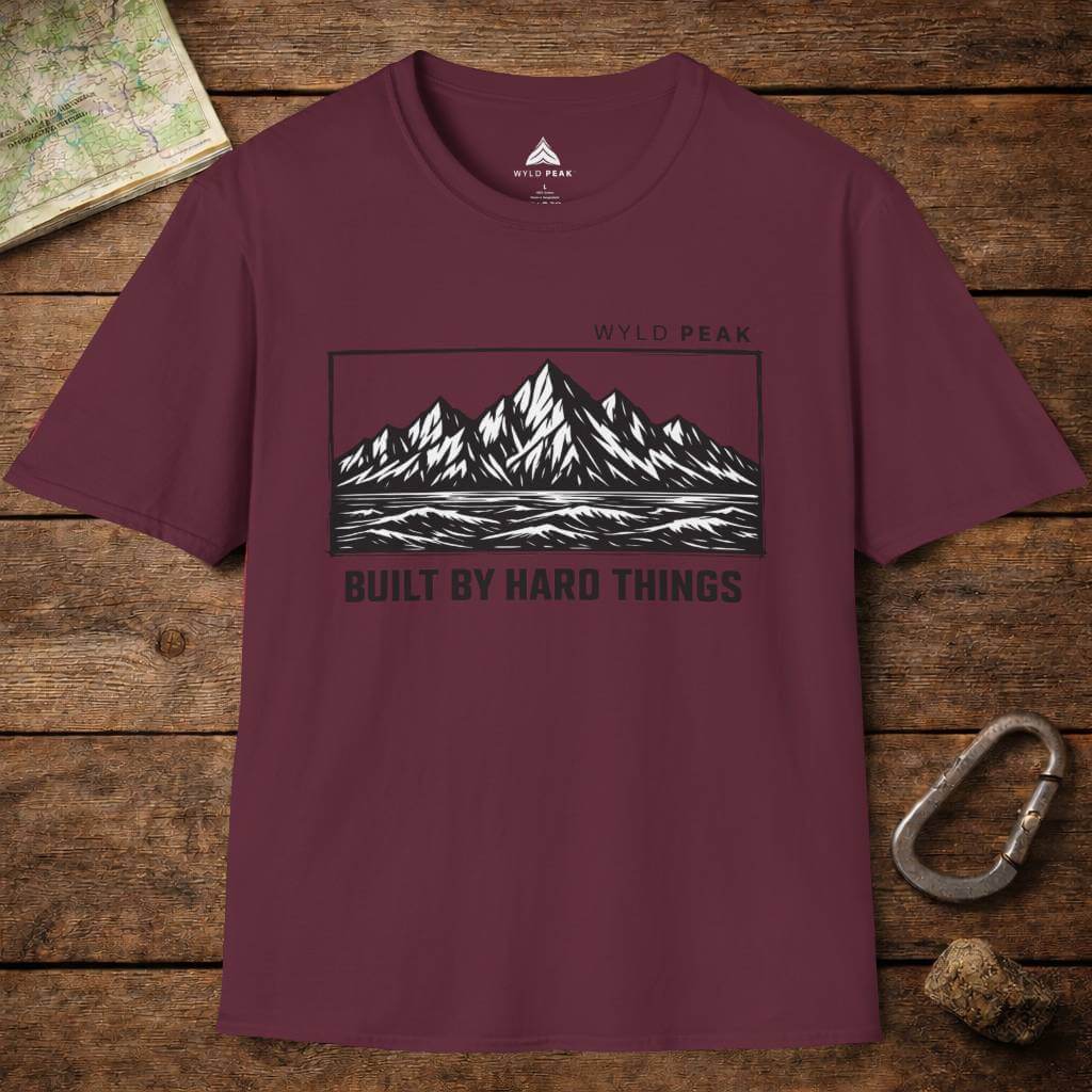 Do Hard Things organic adventure tee in maroon displayed as a layflat, bold colorway with a rugged outdoor message