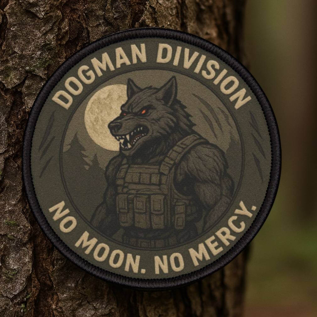 Dogman Division cryptid patch held in a forest, bold faction style design for cryptid enthusiasts
