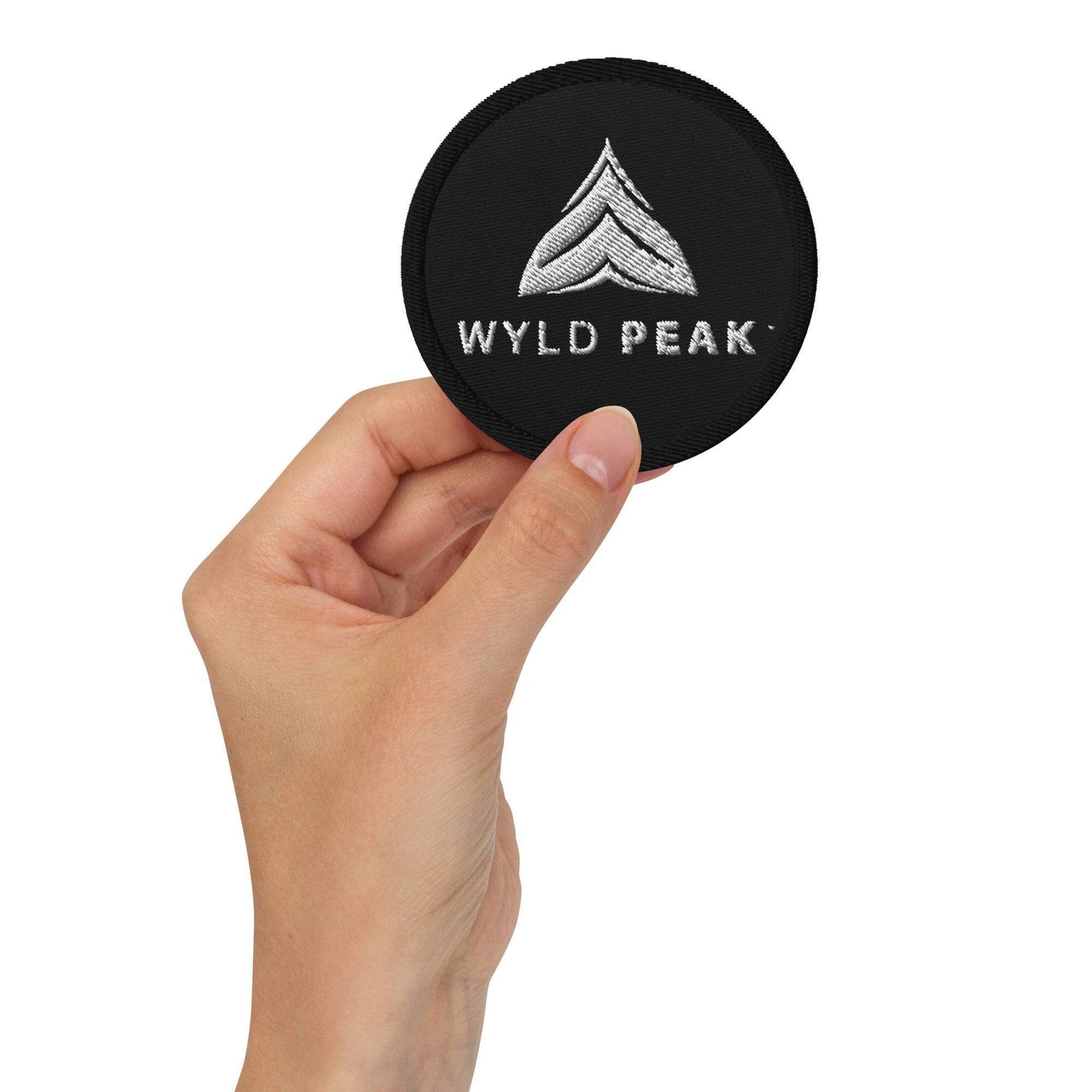 Wyld Peak embroidered logo patch on a white background.