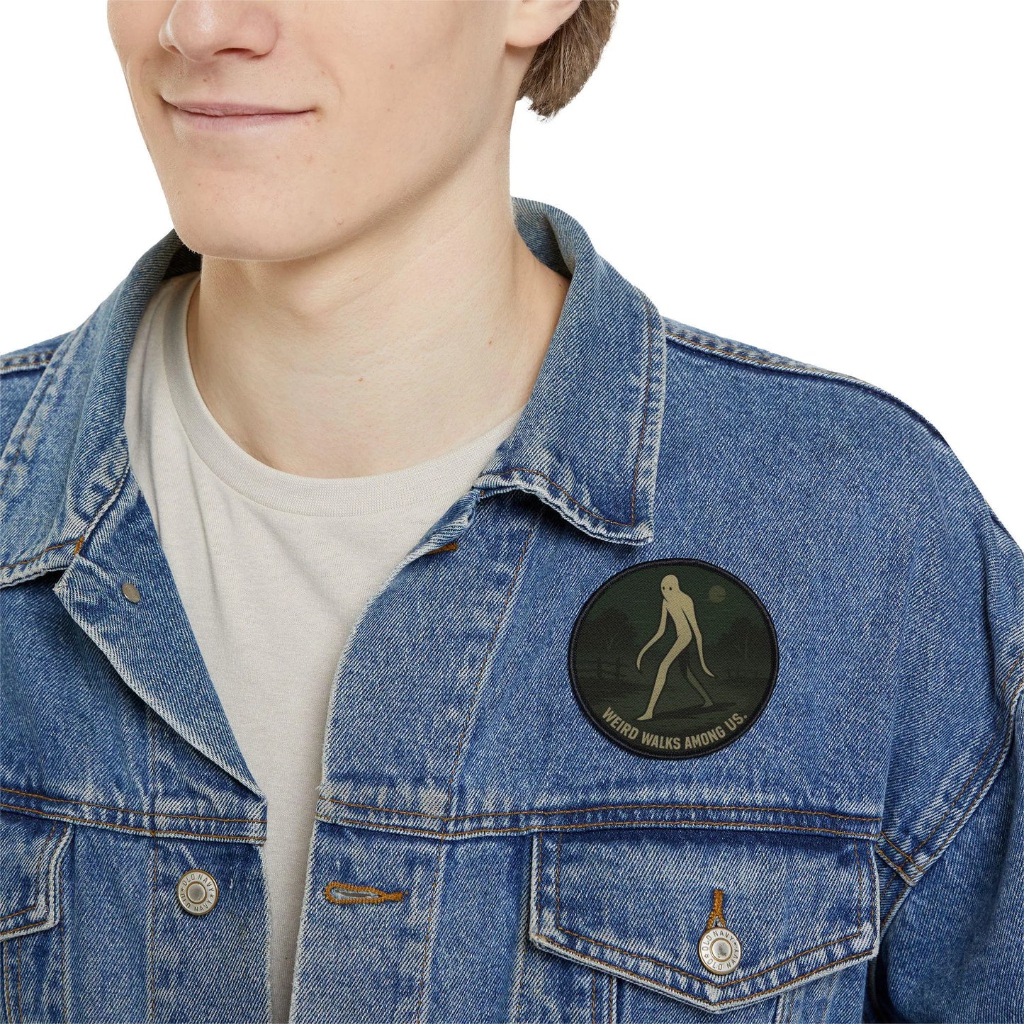 Fresno Nightcrawler embroidered patch worn on a man’s denim jacket, cryptid inspired outdoor streetwear style